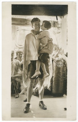 Item #439558 Photograph of Gene Tunney in a Gym holding a Young Girl. Gene TUNNEY