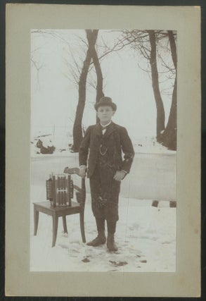 Item #443261 Cabinet Photograph of a Boy with an Accordion in the Snow