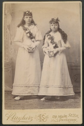 Item #443262 Cabinet Photograph of Two Girls with Flower Crowns and Sashes each holding a Book