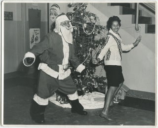 Item #462173 [Press Photograph]: Black Santa Does The Twist with a Black WAC