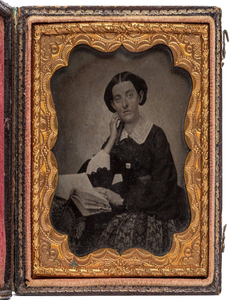 Ambrotype]: Portrait of Carrie M. Mercer holding a book. Carrie M. MERCER.