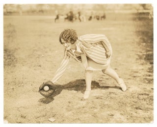 Item #562568 [Photograph]: Mrs. Joe Hauser Scooping 'em up. Wife of Joe Hauser Athletic's First...