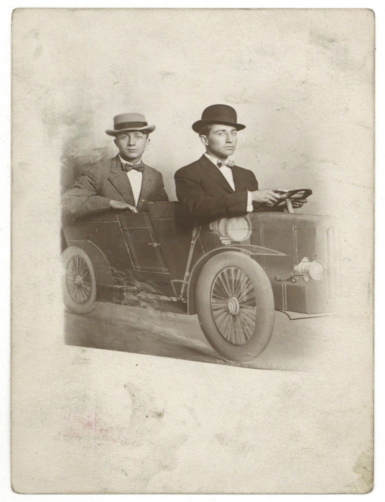 Real Photo Post Card]: Two Young Men Driving a Fake Auto. 1907