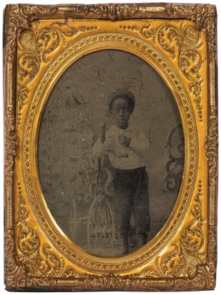 Item #604039 [Tintype photograph]: Young African-American Boy with Tricycle and Straw Hat