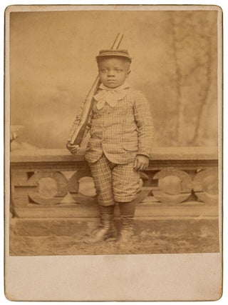 Item #624339 [Cabinet Card Photograph]: A Well-Dressed Young African-American Boy Standing at...